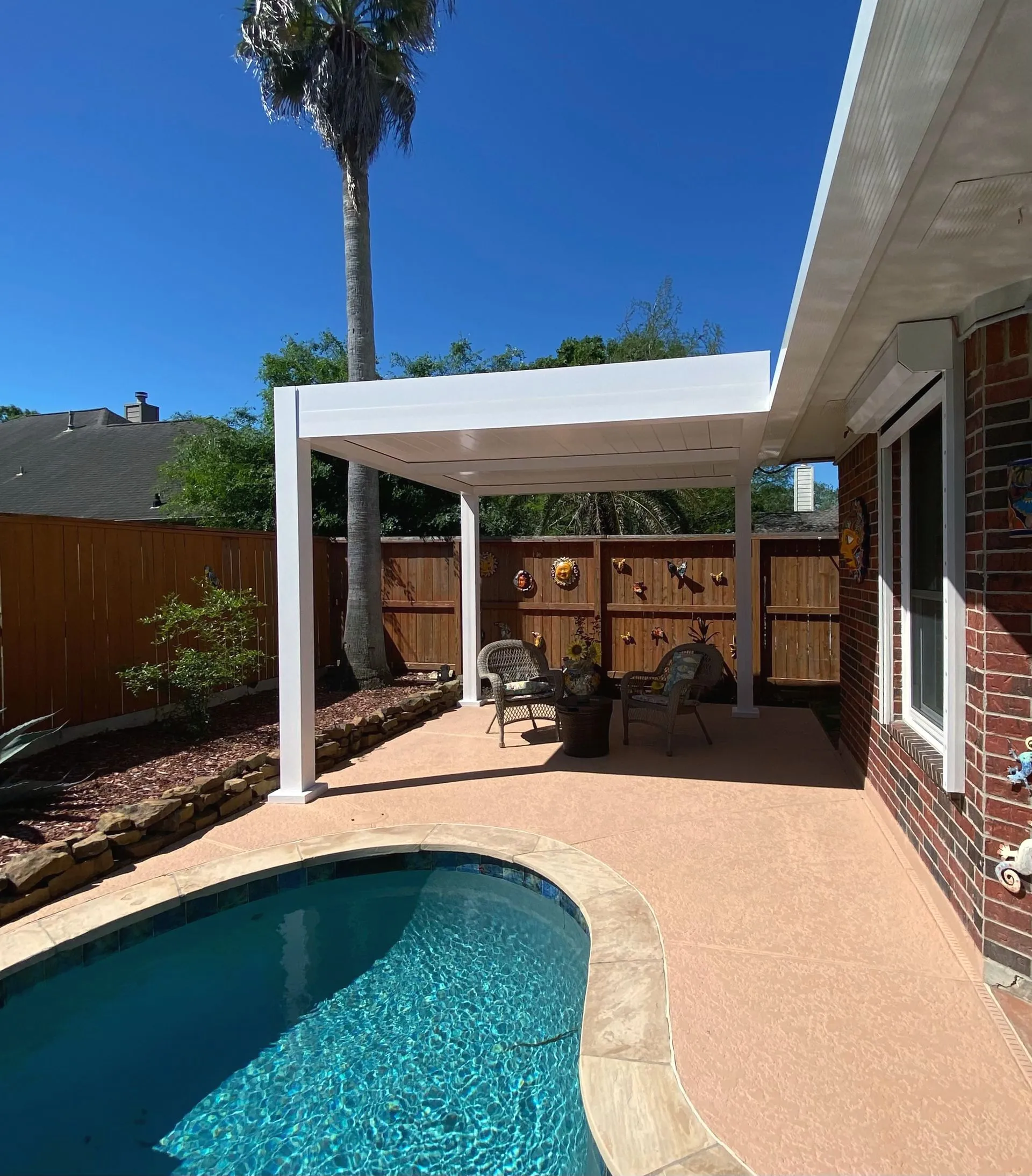Louvered pergola with adjustable roof installed by Kool Covers