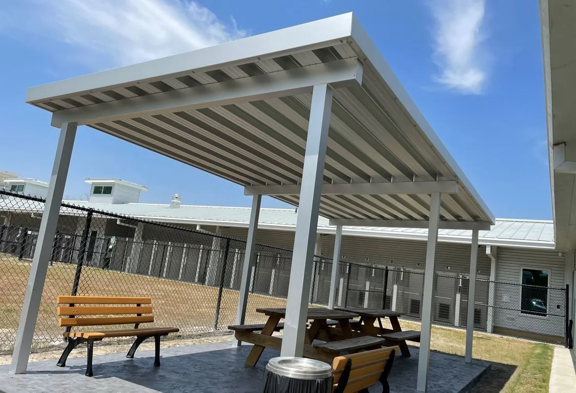Overhead commercial canopy installed by Kool Covers