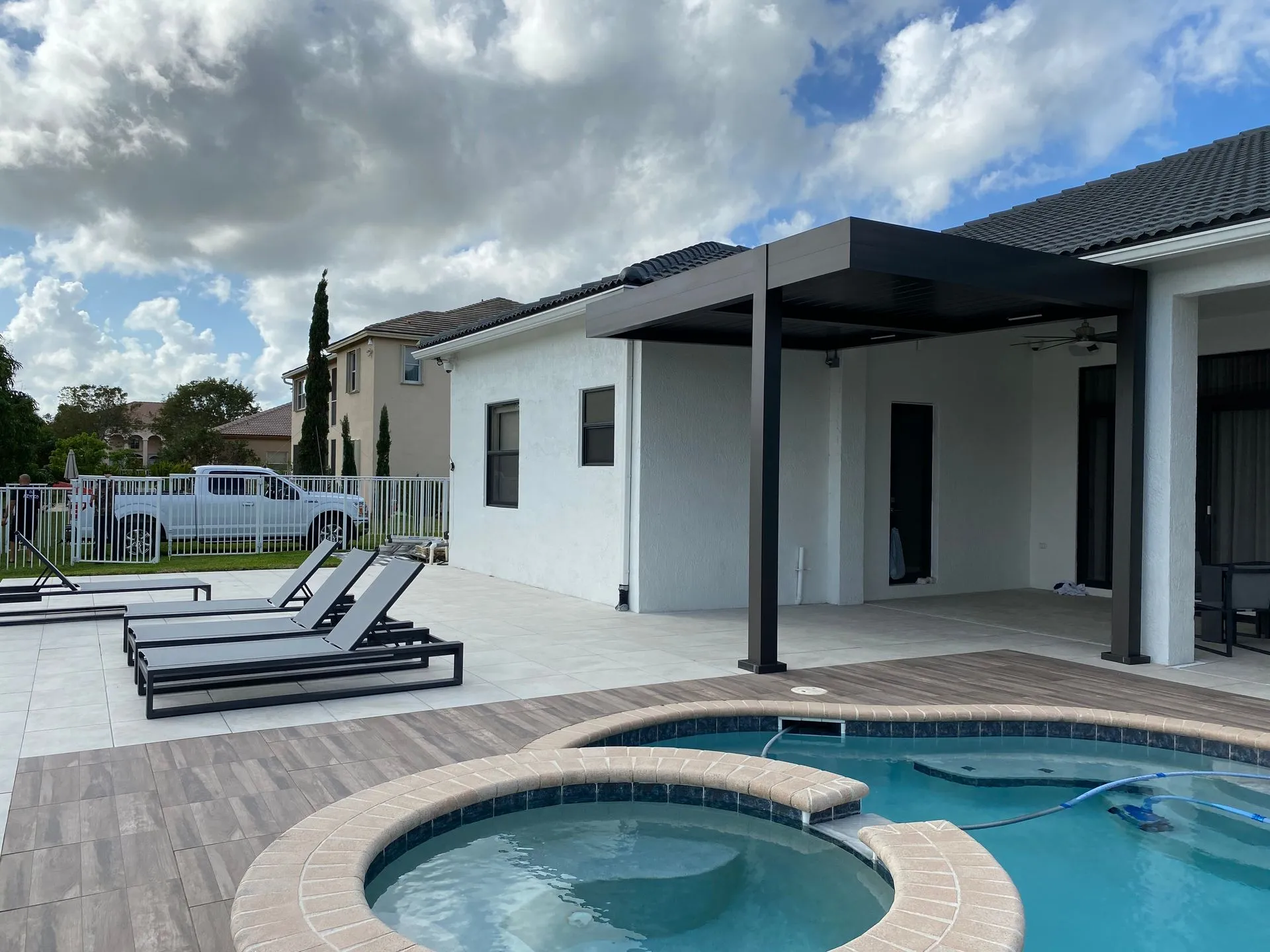 Louvered pergola with adjustable roof installed by Kool Covers