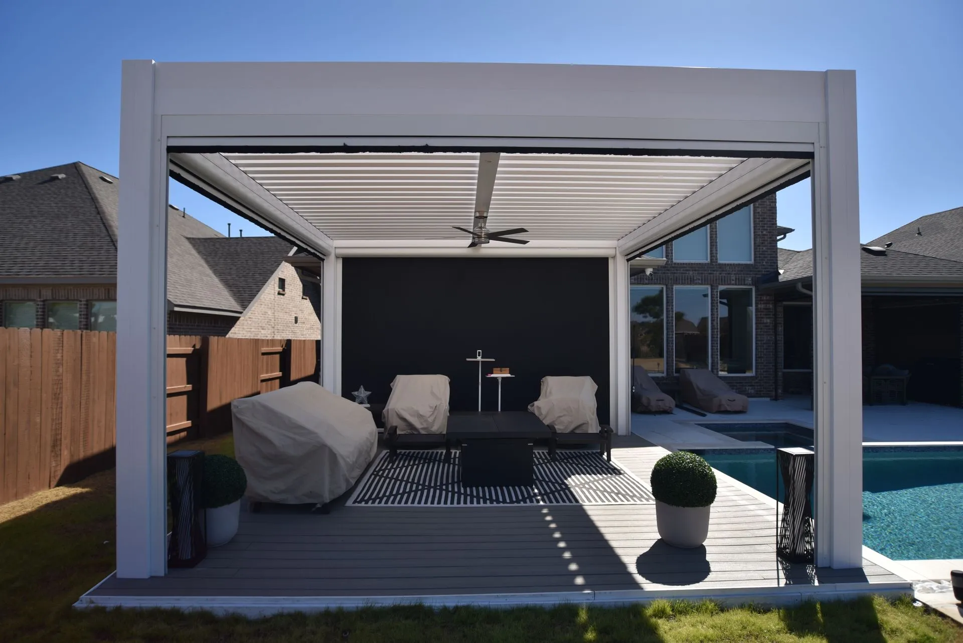 Louvered pergola with adjustable roof installed by Kool Covers