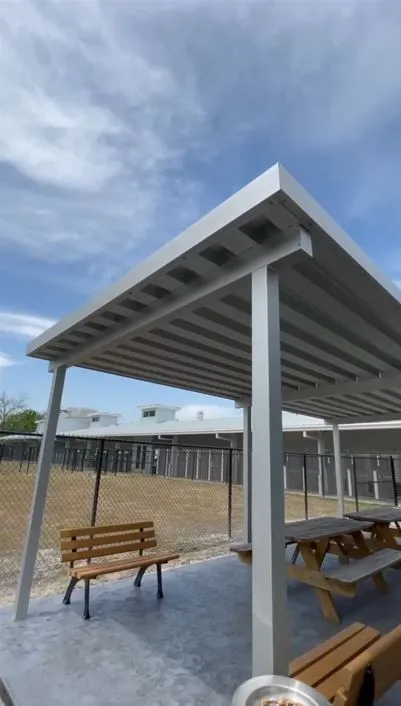 Overhead commercial canopy installed by Kool Covers