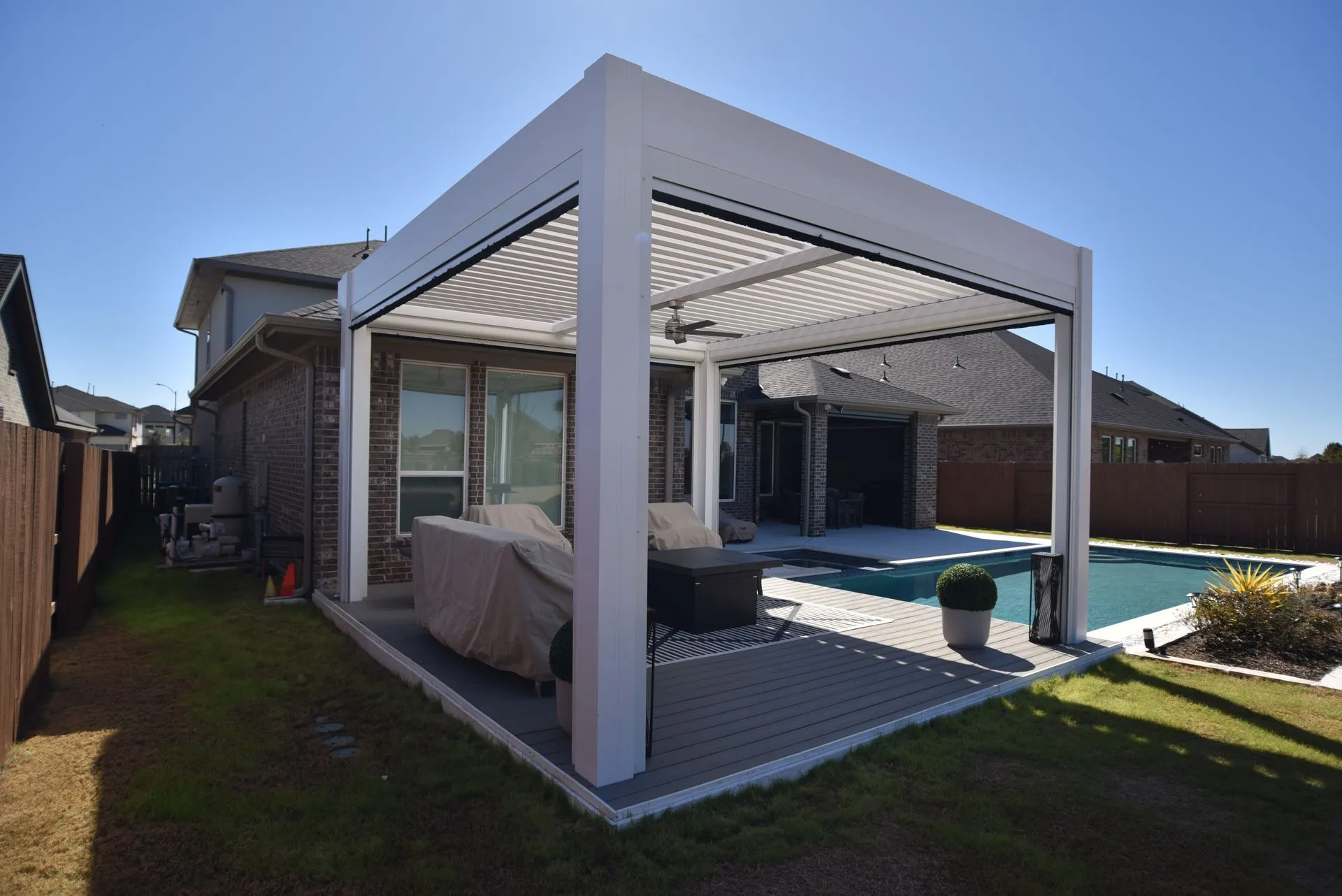 Louvered pergola with adjustable roof installed by Kool Covers